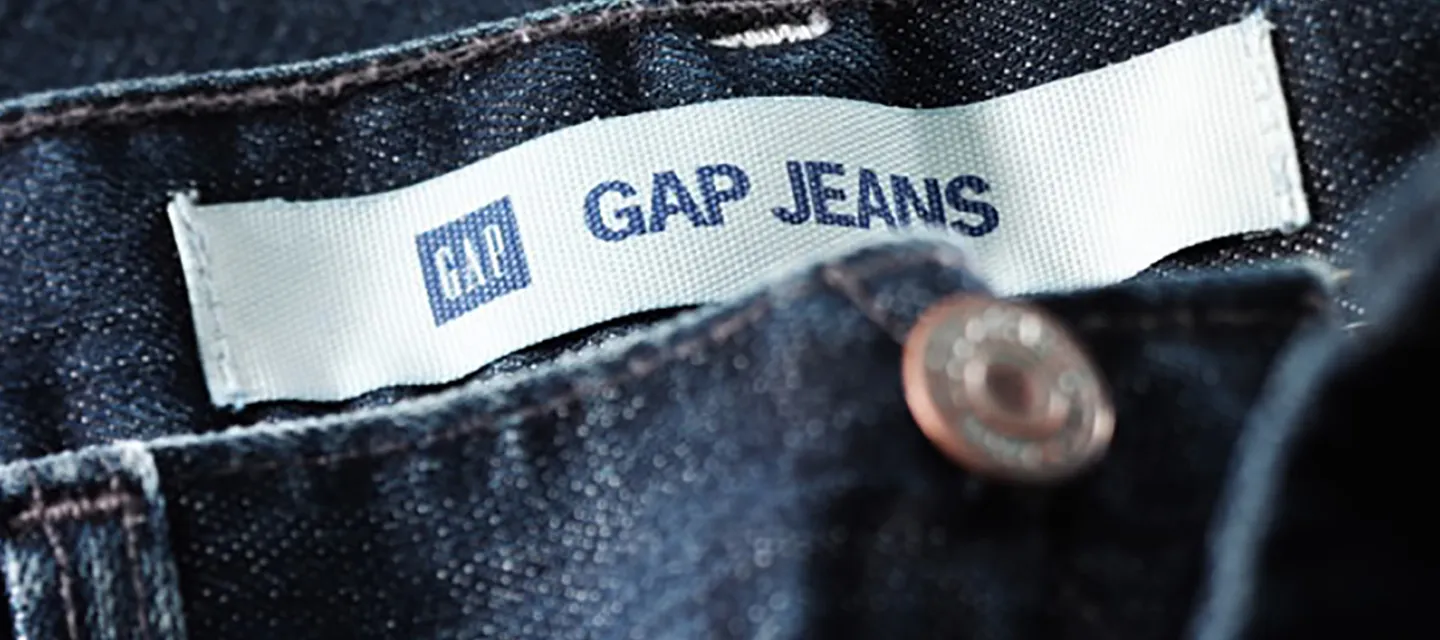 Close up photo of jeans showing the GAP logo