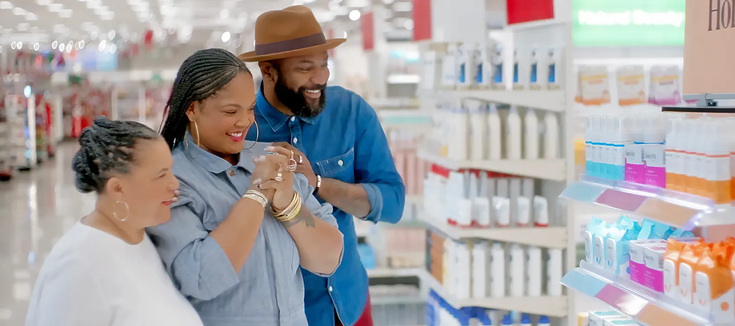 Three people shopping at a Target store